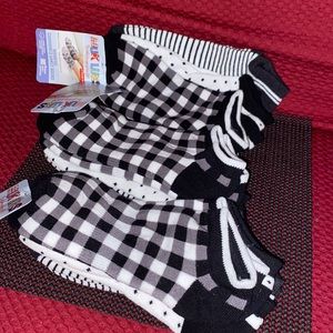 Brand new Muk Luks socks . Black and white